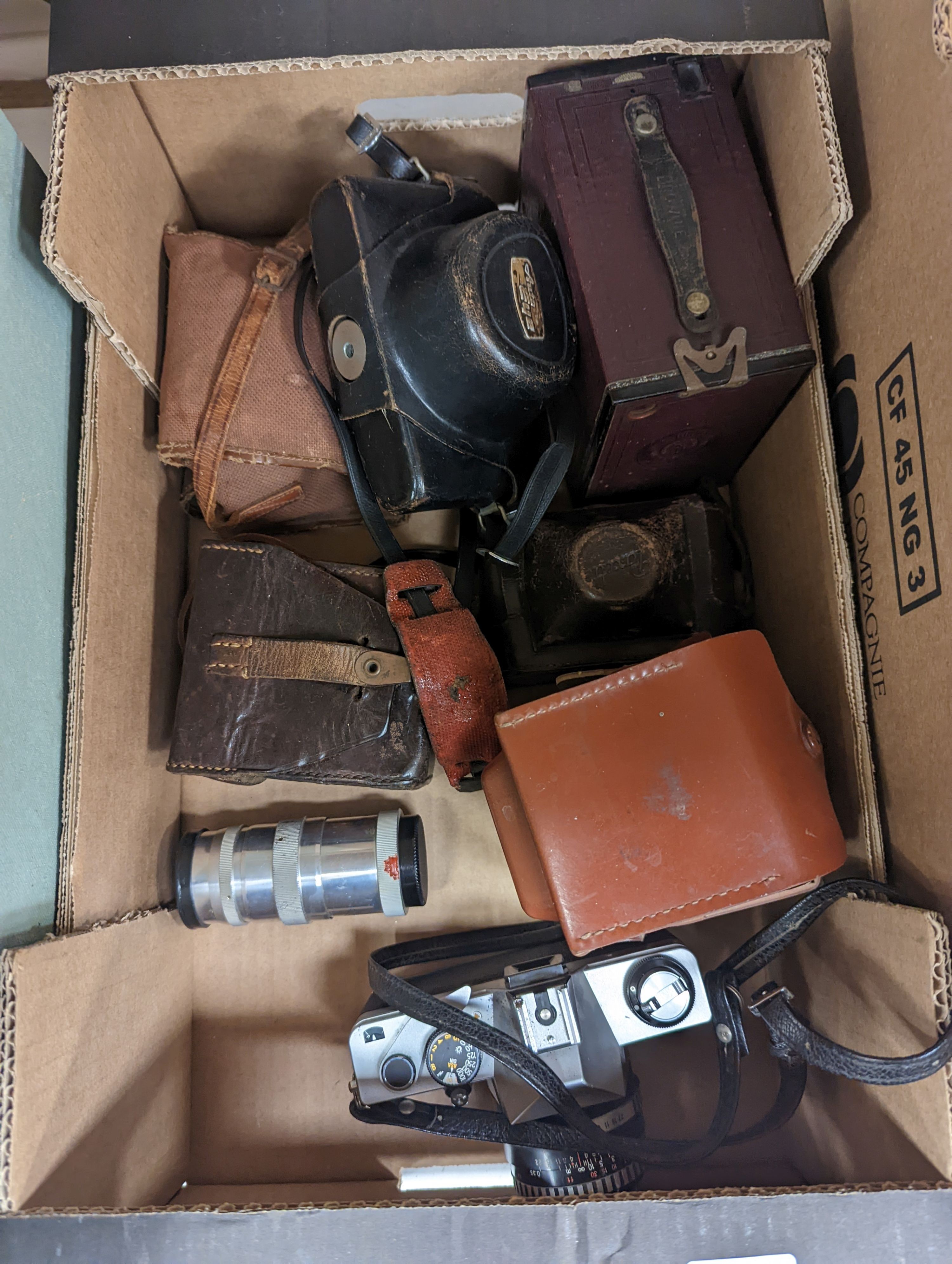 A Polyscop stereo camera together with other 20th century cameras